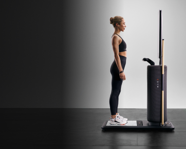 woman standing before the EGYM Fitness Hub seca edition 